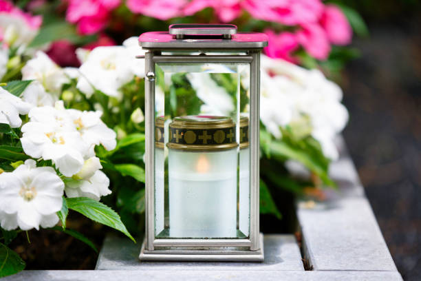 istock lantern with faceted glass and burning devotional candle on a grave 2158026319