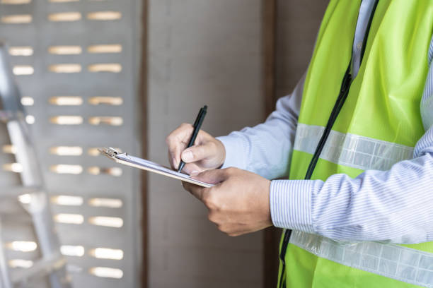 istock inspector or engineer is inspecting construction and quality assurance new house using a checklist. Engineers or architects or contactor work to build the house before handing it over to the homeowner 2158028367