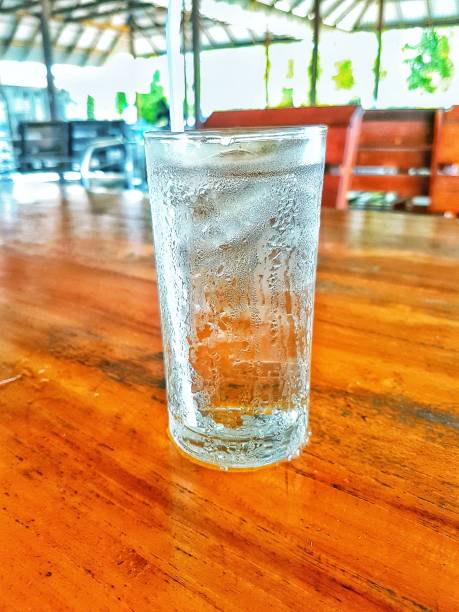Glass of cold water on the table.