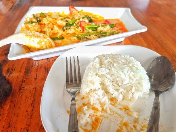 istock Steamed rice that has been eaten and Fried crab with curry  powder. 2158034660