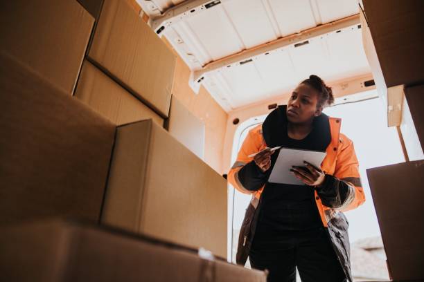 istock Moving worker checking boxes, job & career photo 2158036674