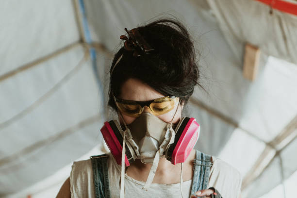 istock Female carpenter wearing personal protective equipment 2158037216