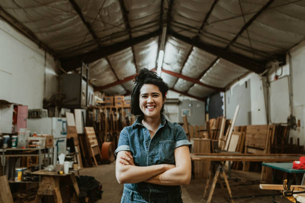 Female carpenter in her wood shop