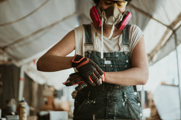istock Female carpenter wearing personal protective equipment 2158037880