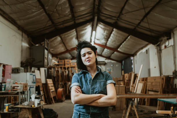 istock Female carpenter in her wood shop 2158037980