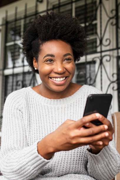 istock African American woman texting on a smartphone 2158038130