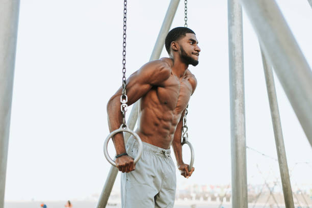 istock Fit man working out at the beach 2158038319