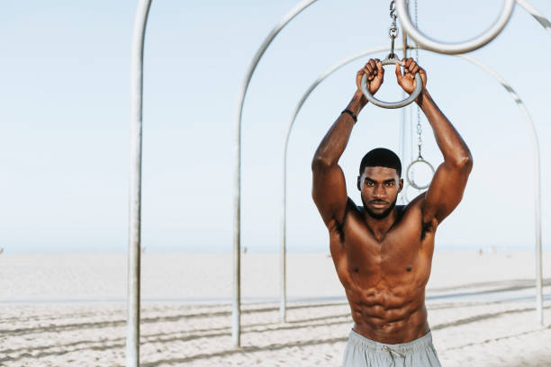 istock Fit man working out at the beach 2158038342