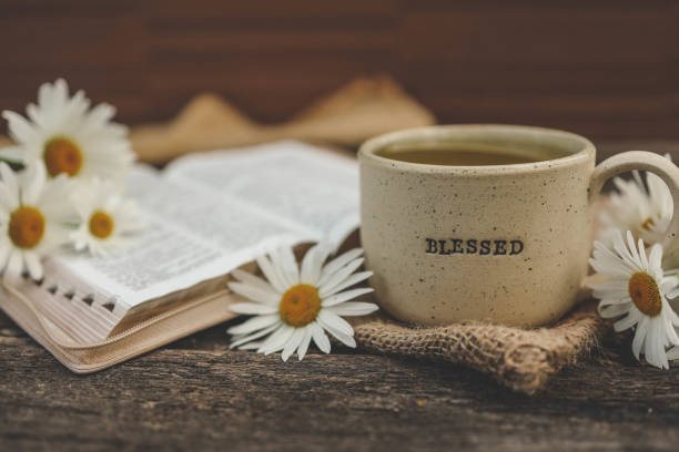 istock Cup with the inscription blessed and open Bible, Christian concept 2158039504