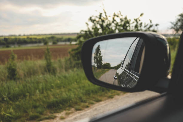 istock Reflected road in rearview mirror, tourism concept 2158040366