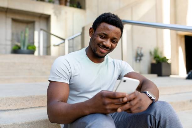 istock African American man texting on a phone 2158040403
