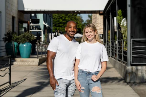 istock Happy couple enjoying a summer date, wearing plain white tee 2158040762