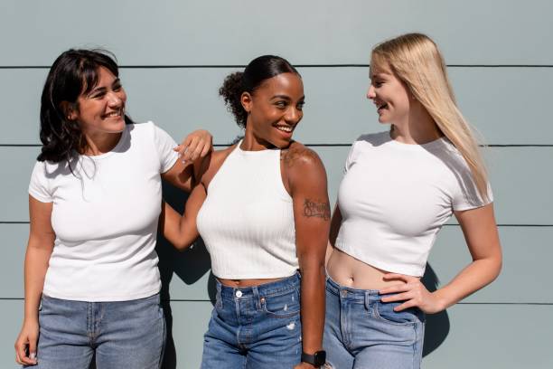 istock Beautiful mixed race women, three girlfriends wearing plain white tees 2158040765