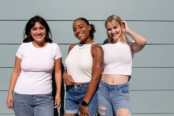 istock Three mixed race girlfriends, confident women wearing plain white apparel 2158040767