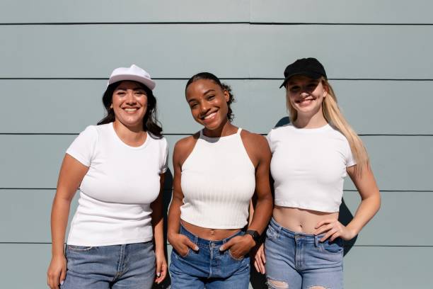 istock Beautiful mixed race women, three confident girlfriends, plain white tees 2158040777