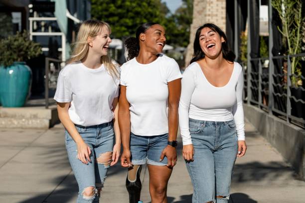 istock Three mixed race women, wearing plain white tshirts, community of inclusion & equality 2158040780