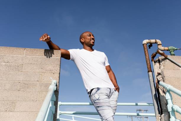 istock Happy African American man posing, wearing plain white tee 2158040789
