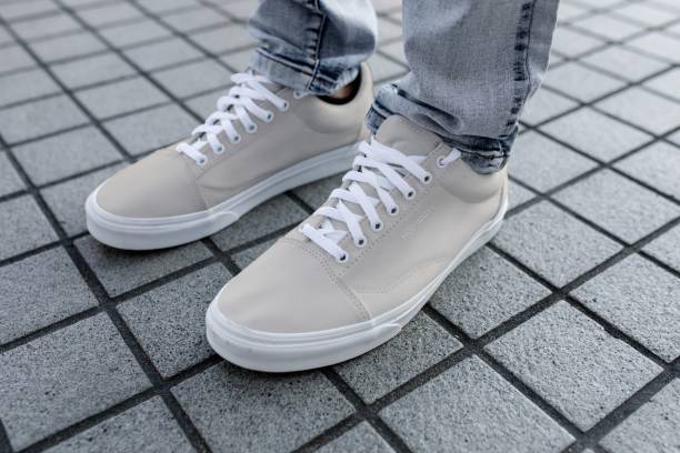 istock Plain sneaker, men's footwear on a grey tiled floor 2158040847