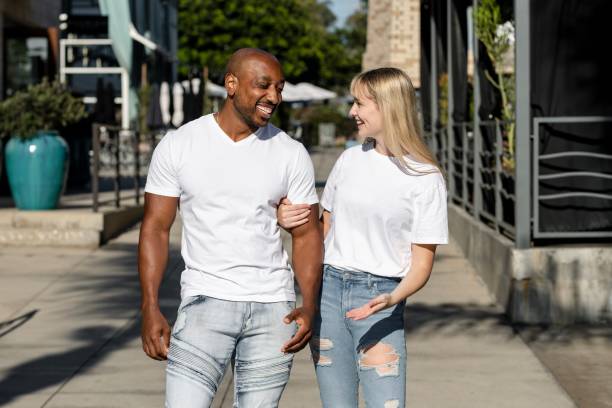 istock Happy couple enjoying a summer date, wearing plain white tee 2158040867