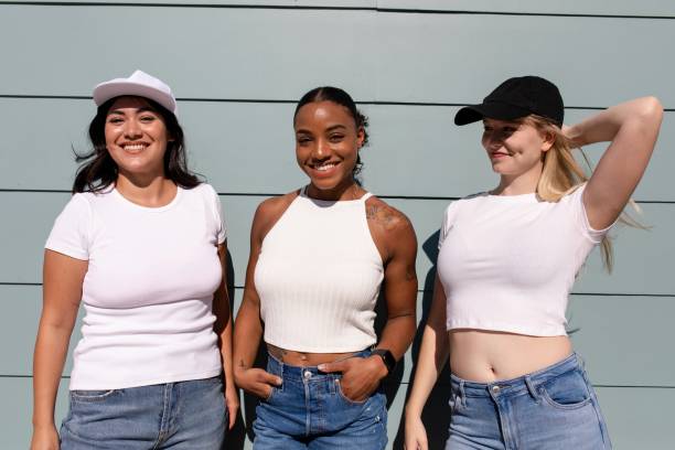 istock Three mixed race girlfriends, beautiful women wearing plain white apparel 2158040905