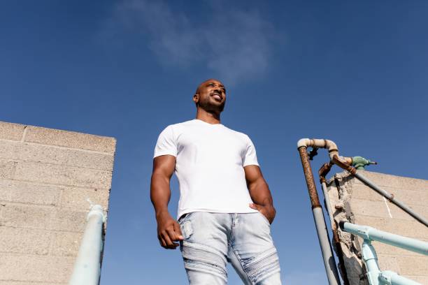 istock Confident African American man posing, wearing plain white tee 2158040913