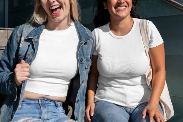 istock Happy friends plain white tee, women on college campus 2158041042