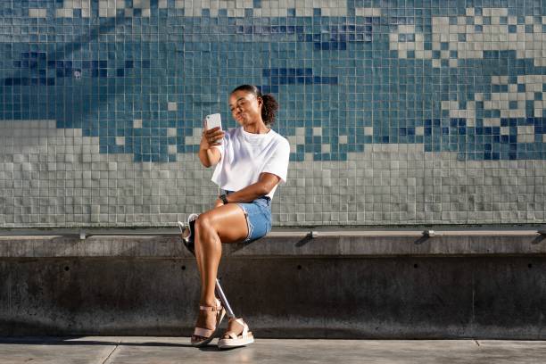istock Happy disabled woman taking a selfie 2158041046