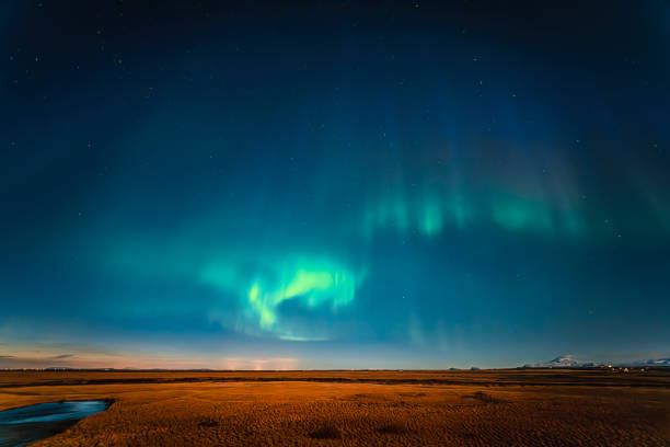 Northern Light Aurora at grass area in Iceland at Night