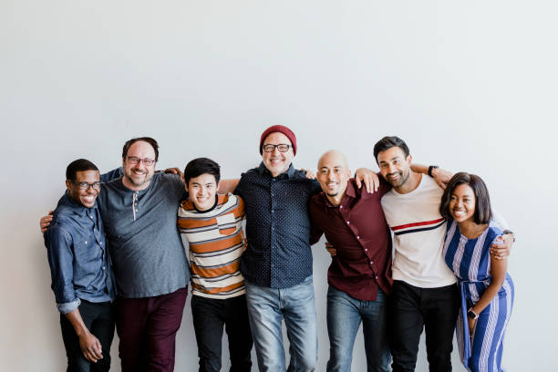 istock Cheerful diverse people embracing each other 2158042846