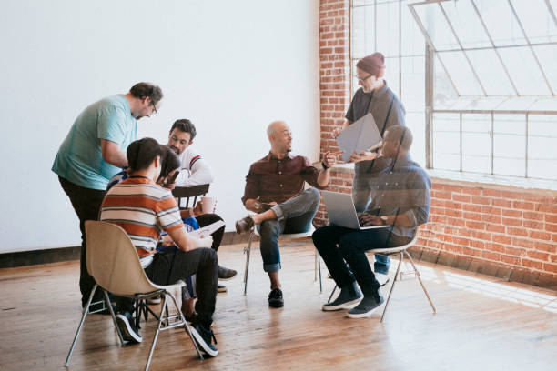 istock Diverse business people discussing in a workshop 2158043578