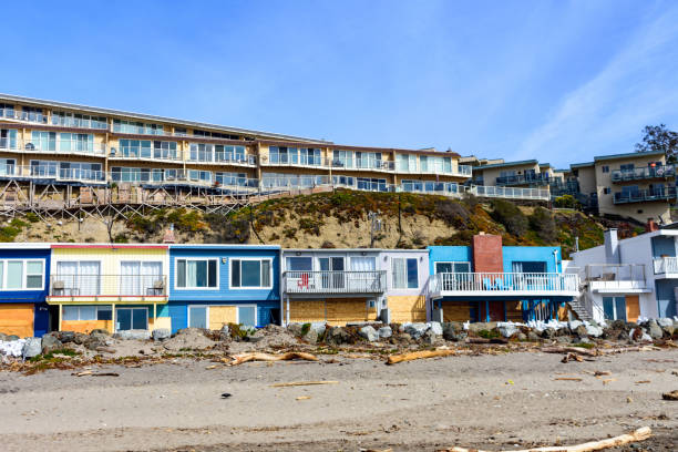 istock Beachfront houses overlook a sandy Rio Del Mar Beach strewn with debris. 2158043696