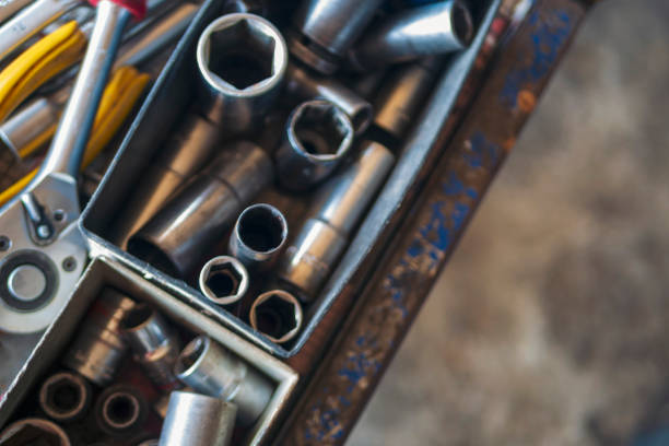 istock Mechanic tools engineering equipment car auto repair shop with copy space. Blurred background mechanical service. Heavy screw grungy rusted wrenches dirty screwdriver object. Industrial hardware set 2158043744