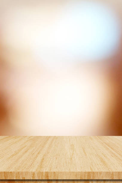 Table and blur background, Wooden counter over blur bokeh light background, Brown wood table top, shelf for food and retail shop, store product display backdrop, banner, mockup, template