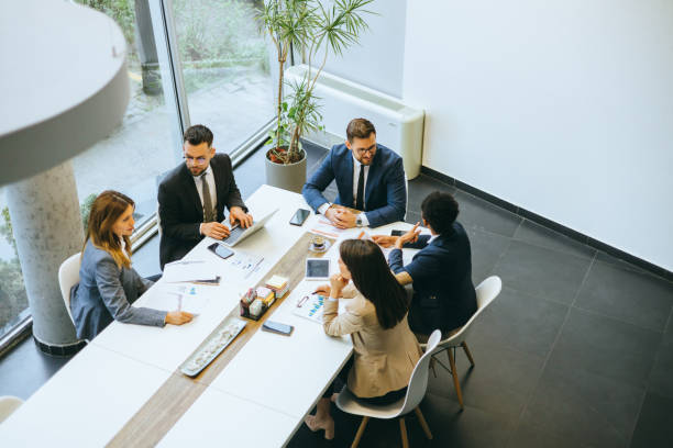 istock Corporate team in discussion at modern office 2158044590