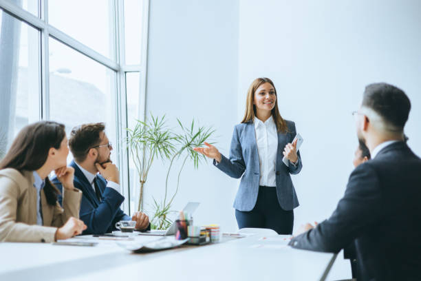 Business manager engaging with team members
