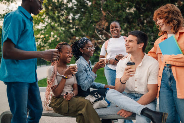 istock Interracial group of college students chatting on coffee break at campus 2158044914