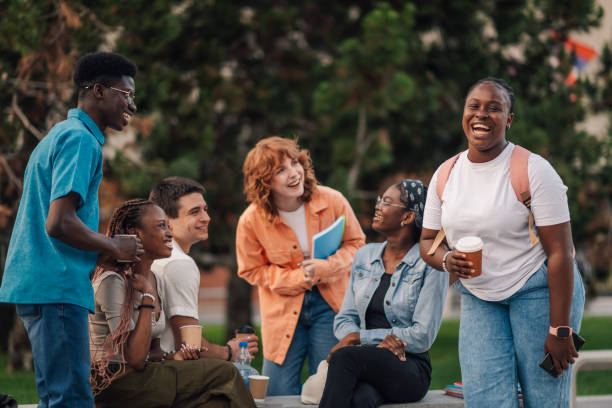 istock Happy interracial academic friends having fun on coffee break at campus 2158044919
