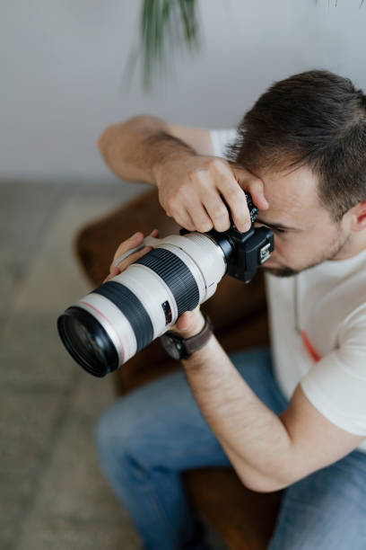 istock Professional photographer shooting at home 2158044991