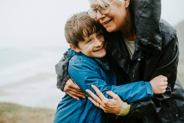 istock Happy grandmother hugging her grandson 2158045465