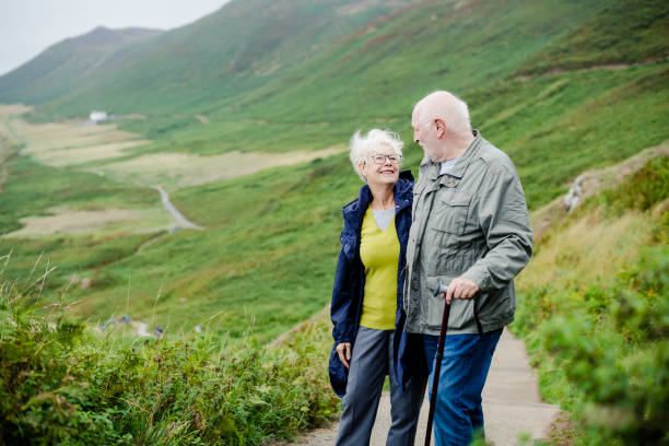 istock Happy romantic seniors strolling together 2158045506