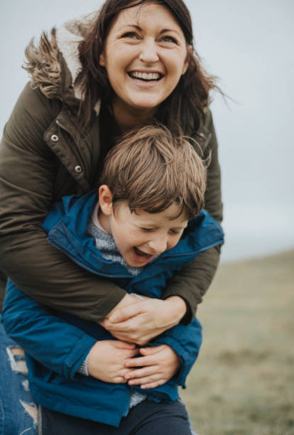 istock Cheerful mother embracing her son 2158046005