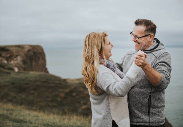 istock Romantic senior couple dancing on a hill 2158046034