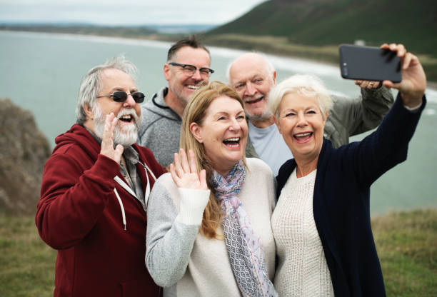 istock Group of happy seniors taking a selfie 2158046050