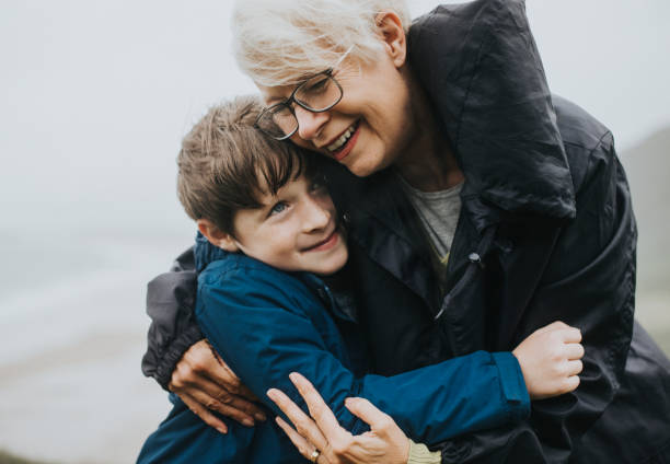 istock Happy grandmother hugging her grandson 2158046053