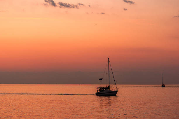Niagara-on-the-Lake, Ontario, Canada - July 01, 2020; As twilight falling, fishing boats turned homeward.