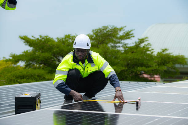 istock Engineer and technician inspects solar panel installation and test the operation of the panel 2158046828