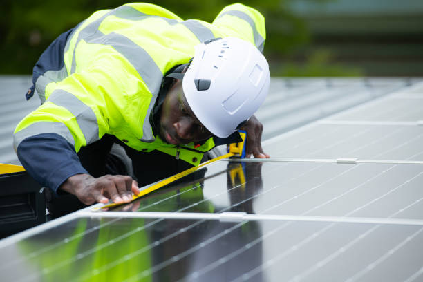 istock Engineer and technician inspects solar panel installation and test the operation of the panel 2158047528