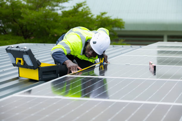 istock Engineer and technician inspects solar panel installation and test the operation of the panel 2158047614