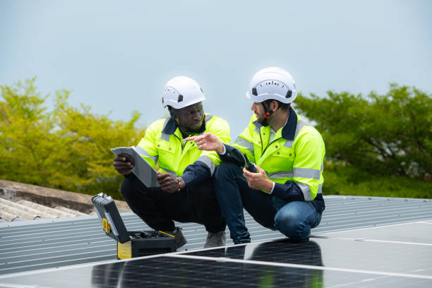 istock Engineer and technician inspects solar panel installation and test the operation of the panel 2158047619