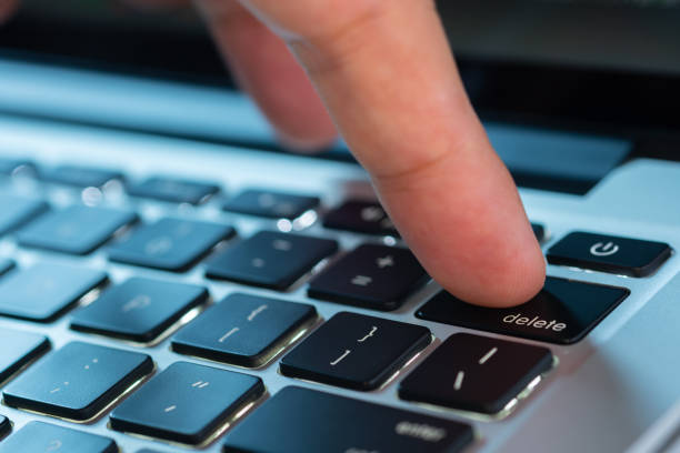istock Finger of the computer user, he presses the delete button on the computer keyboard. 2158049329